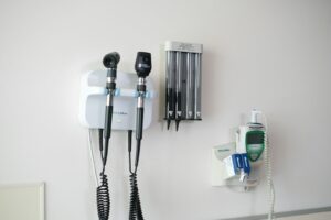 Medical diagnostic tools mounted on a wall.