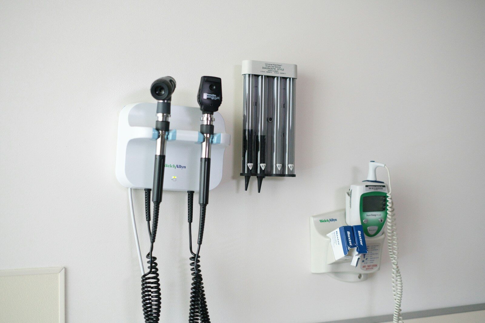 Medical diagnostic tools mounted on a wall.